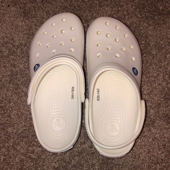 white crocs with black stripe